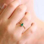 ring with emerald on hand