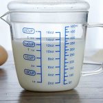 Measuring cup with milk