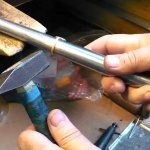 Rolling out a ring in a jewelry workshop